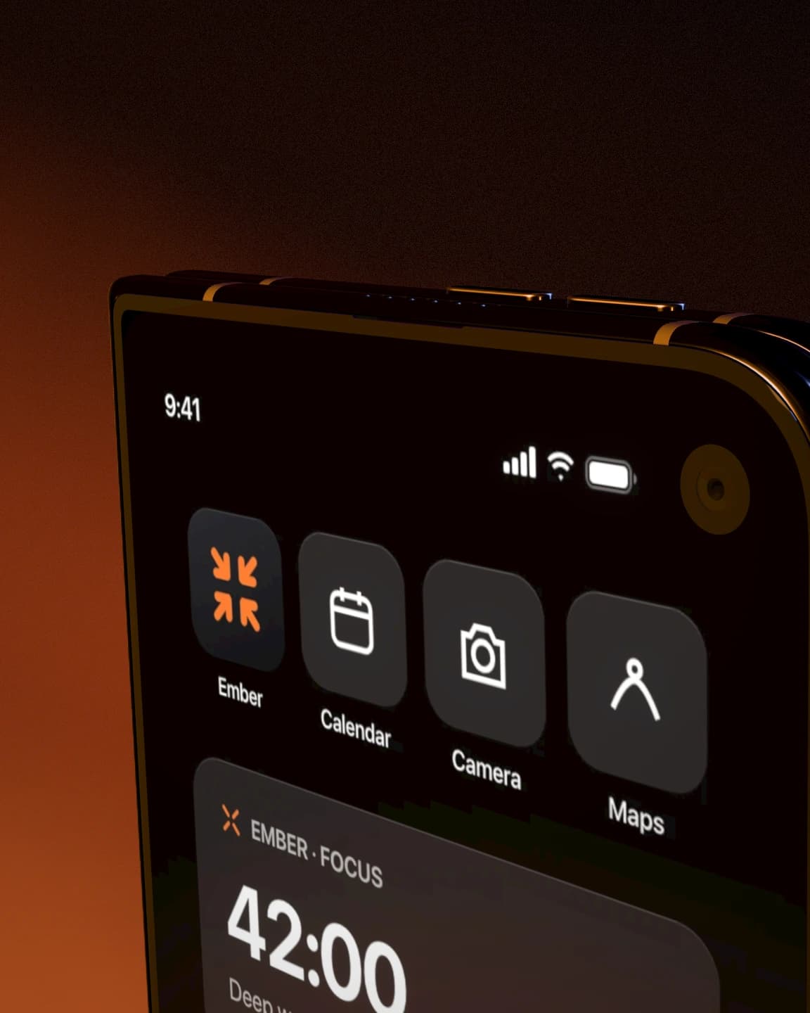 Close-up — A tight crop on the top corner of a gold Duo, with warm light falling off into black.